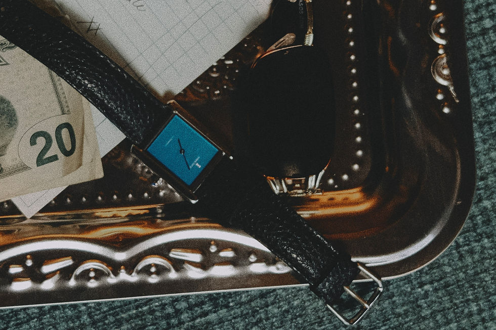 Eye-level view of a collector's edition watch displayed on a wooden surface