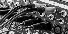 Audio cables running into a patch bay