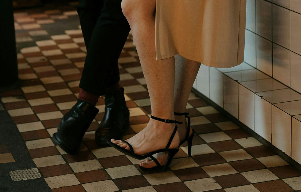 couple's legs dressed up in diner.JPG