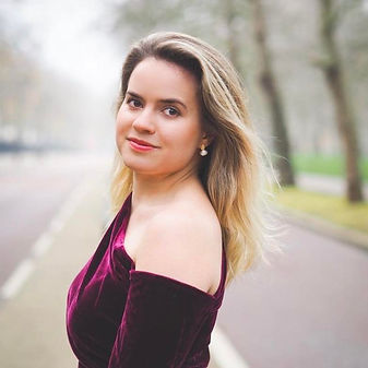 Helena Moore is a British soprano from Herefordshire. She graduated with distinction from the Royal Academy of Music after reading Music at Trinity College, Cambridge. She received an entrance scholarship to continue her studies at the Alexander Gibson Opera School at the Royal Conservatoire of Scotland. At the Royal Academy, she was a Finzi Trust Scholar and Bach Kohn Foundation Scholar, as well as receiving the Ethel Bisland Award, and the G Embley Memorial Prize for an outstanding final recital.

In 2020, Helena reached the semi-finals of the Kathleen Ferrier Competition and was nominated for the song prize. Subsequently, she was selected as a young artist for the 2022 Ludlow English Song Festival, working with Iain Burnside and performing with Mark Rogers. In 2023 she was selected as a Leeds Lieder Young Artist, performing with Francesca Orlando and working with Julius Drake, Susan Manoff, and Joan Rodgers. Helena’s love for song repertoire began at Cambridge University where she was selected for the Pembroke Lieder Scheme two years in a row by Joseph Middleton, taking part in regular masterclasses. Other competition successes include reaching the semifinals of the Somerset Song Prize, and winning the French Song Prize (Royal Academy of Music).

In 2022 she was a Garsington Alvarez Young Artist performing in Così fan tutte and Rusalka, which toured to Edinburgh International Festival. Leading opera roles include Galatea (Acis and Galatea), Pamina (Magic Flute), Gretel (Hansel and Gretel), Iphis (Jephtha) and Venus (Venus and Adonis). Operatic roles in scenes include Adina (L’elisir d’amore), The Governess (Turn of the Screw), Almirena (Rinaldo), Rodelinda (Rodelinda), Sophie (Werther), Ilia (Idomeneo), and Despina (Così fan tutte). 

Helena is an experienced oratorio soloist, recently making her Danish debut performing Messiah solos with the Henrikes Drengekor and Ensemble Midvest in 2021. Whilst at music college, she worked regularly as a Josephine Baker Trust scholar, performing multiple Bach Cantatas as a Kohn Foundation scholar, including solos with Masaaki Susuki, Phillipe Herewegge and John Butt. She regularly sings with the Dunedin Consort, the Academy of Ancient Music, and the English Concert, with whom she looks forward to performing Messiah in Valencia at the end of this season. She was due to make her Wigmore Hall debut in 2020, as a soloist with the RAM baroque orchestra (postponed due to Covid-19).