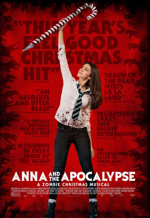 Anna And The Apocalypse movie poster. A teen girl holds a decorative oversized candy cane above her head, the end sharpened. She is wearing a school uniform splattered in blood.