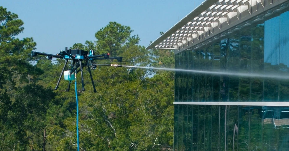 Drone washing windows on commercial building