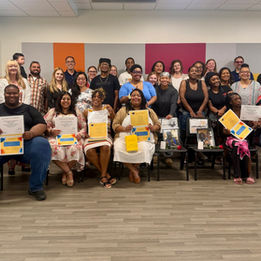 A group photo of the training program graduates, with their families, friends and program providers