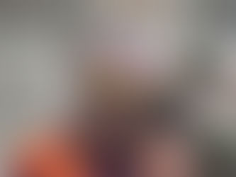 Walter and his wife, Vivian together near a fleet of semi trucks