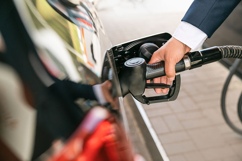 A businessman in a suit manages his car
