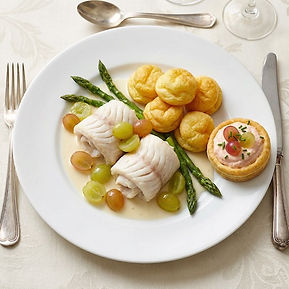 Sole Véronique: Poached Lemon Sole with Grapes, Pommes Soufflées, Wild Asparagus, White Wine Vermouth Cream Sauce, and a Taramasalata Tart with Pickled Grapes and Chives