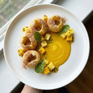 Potato Soufflé with Golden Milk, Tropical Fruit and Mustard Greens