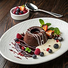 Chocolate Molten Lava Cake with Berries and White Chocolate Drizzle