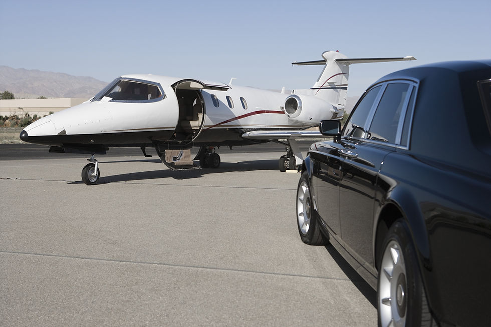Limousine and private jet on landing strip