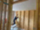 A man fitting insulation