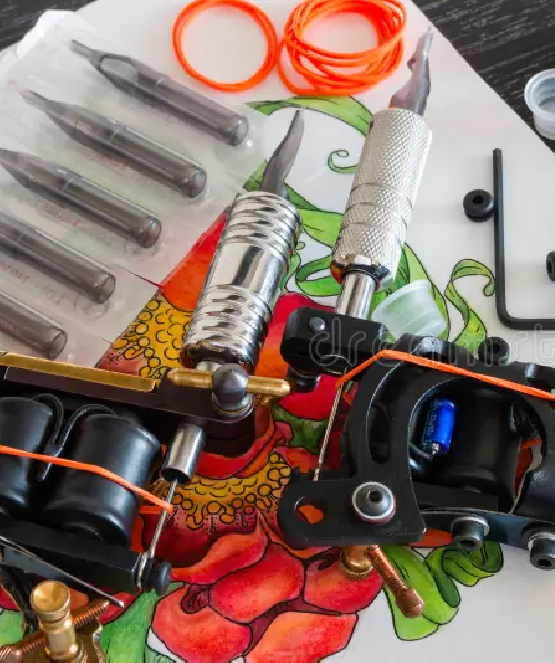 Close-up view of tattoo equipment neatly arranged on a tray