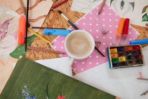 cup-coffee-painters-supplies-table.jpg