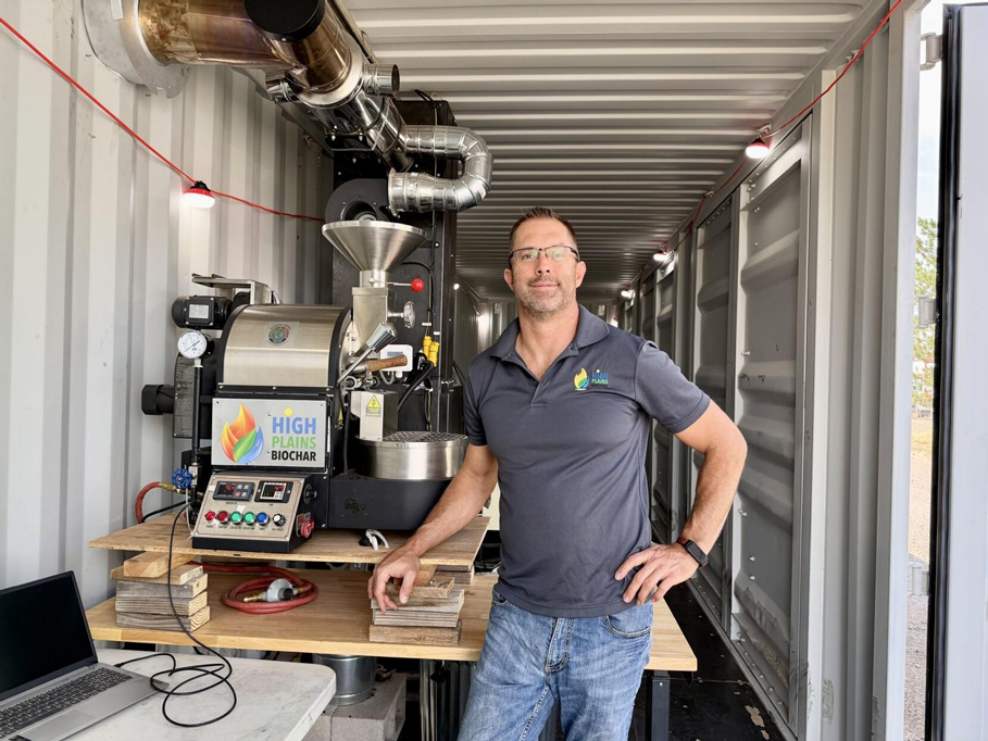 Rowdy Yeatts, High Plains Biochar LLC and Climate Coffee founder, owner and CEO, is shown next to the company’s roaster. Kaileen
Gruber/Laramie Boomerang