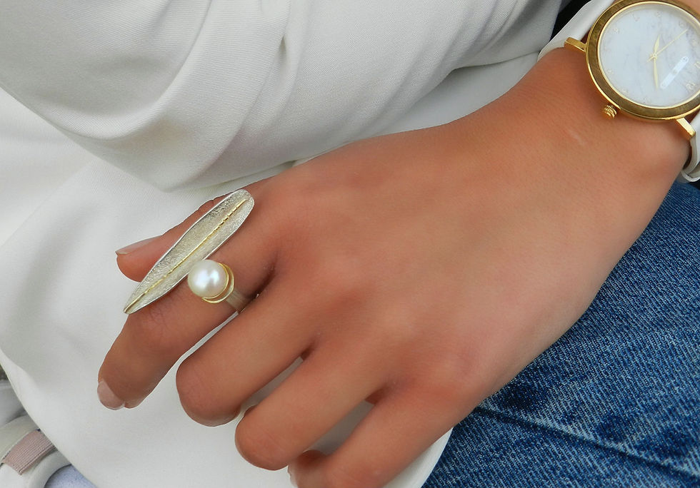 Remarkable Leaf Pearl Ring with gold plated details.