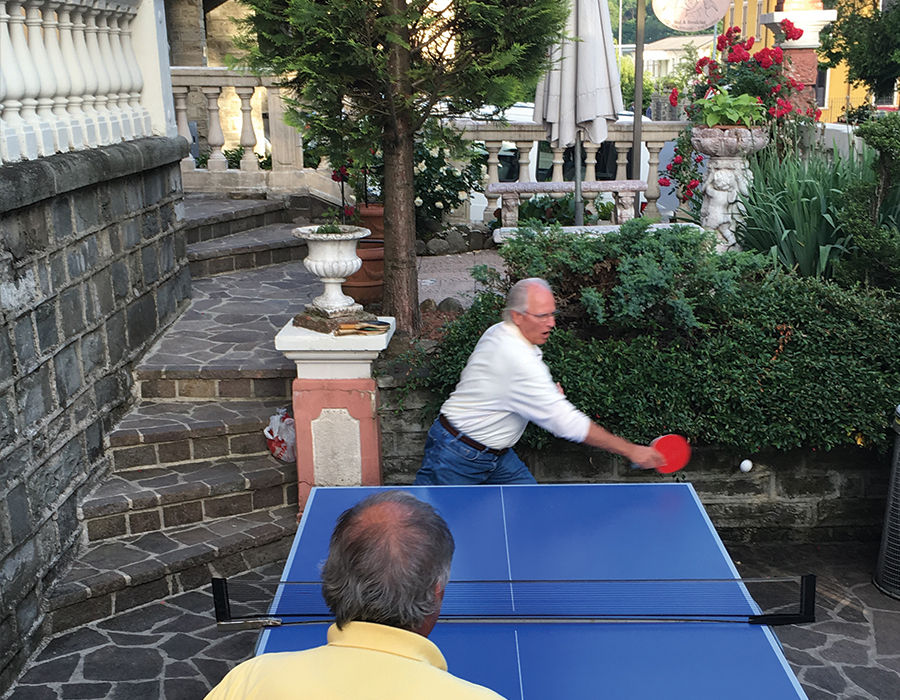 two elderly people playing table tennis at Villa Tre Angeli