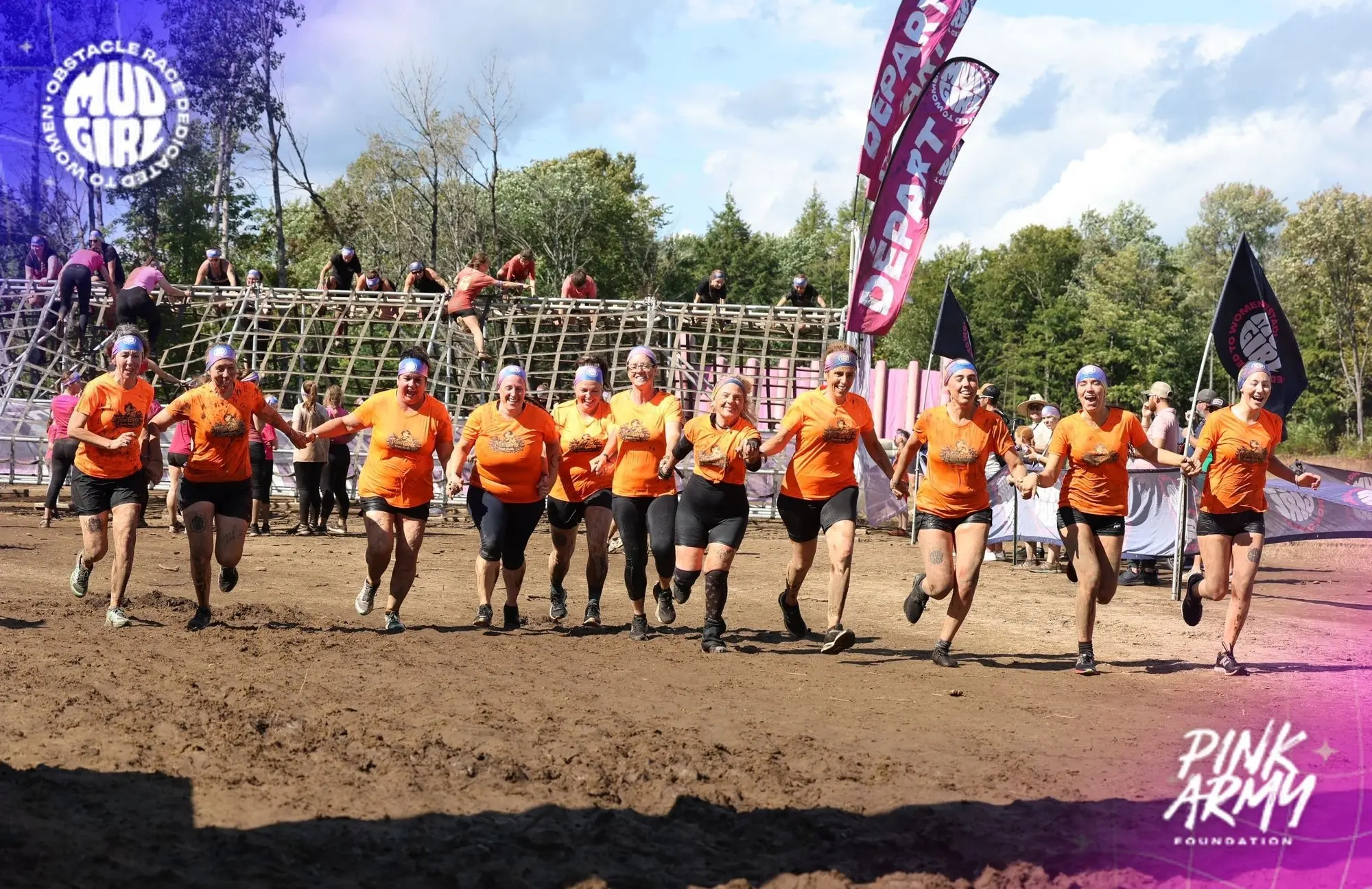 The Kwiik team running hand in hand at the start of the MUDGIRL obstacle race