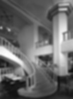 Black and white photo of staircase showing before renovation