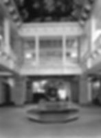 Black and white photo of lobby showing before renovation