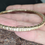 Thumbnail: Side view of textured bronze bracelet resting on a stone surface