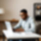 A black man working on a laptop.jpg