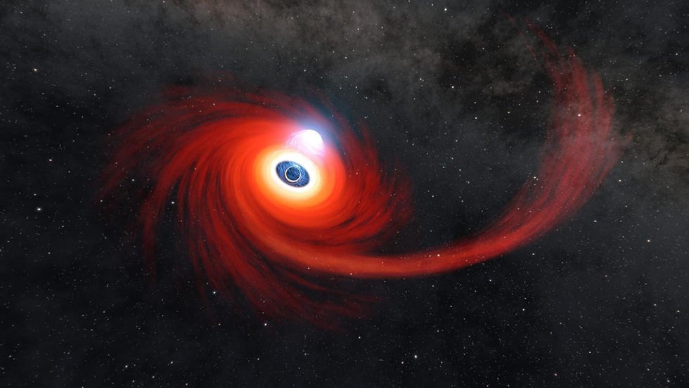 A disc of hot gas swirls around a black hole - the remnants of a star pulled apart by the black hole. (NASA/JPL)