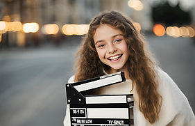 happy teenager with movie clapperboard(1).jpg