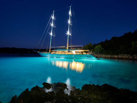 sailing yacht on blue waters