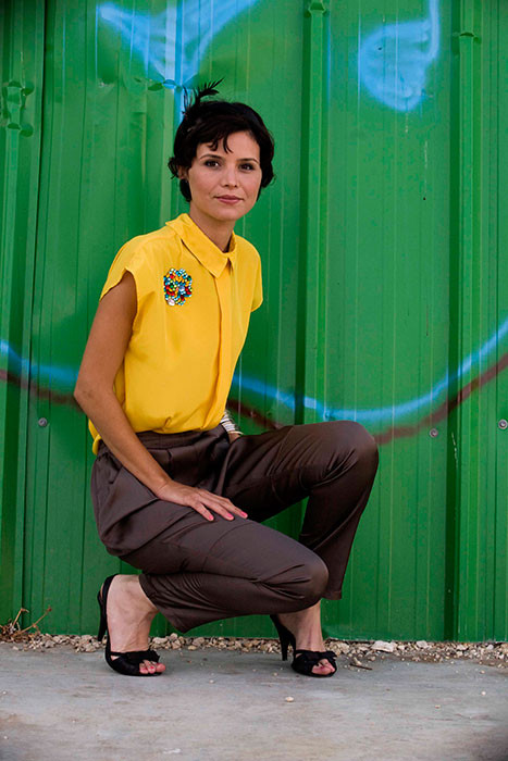 Woman in bright yellow blouse.