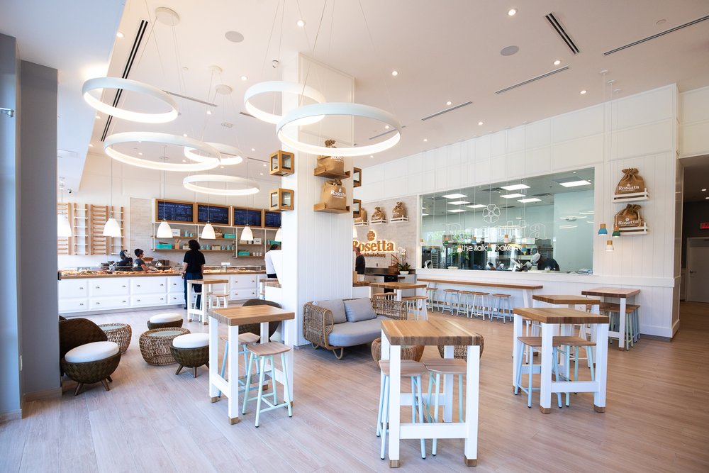 Spacious, bright seating area inside Rosetta Bakery Buckhead.