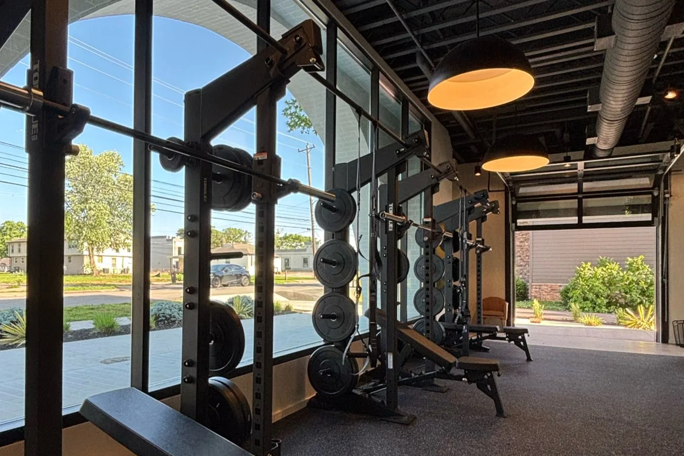 STAT Wellness Berry Hill studio with large windows and fitness equipment