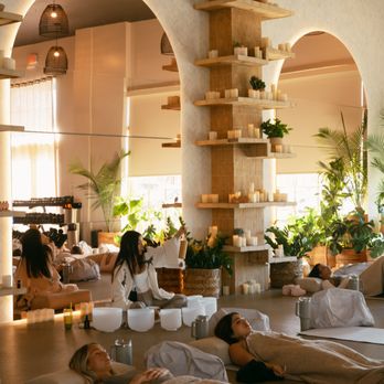 Group workout at Jungle Studio Dallas in warm, plant-filled studio