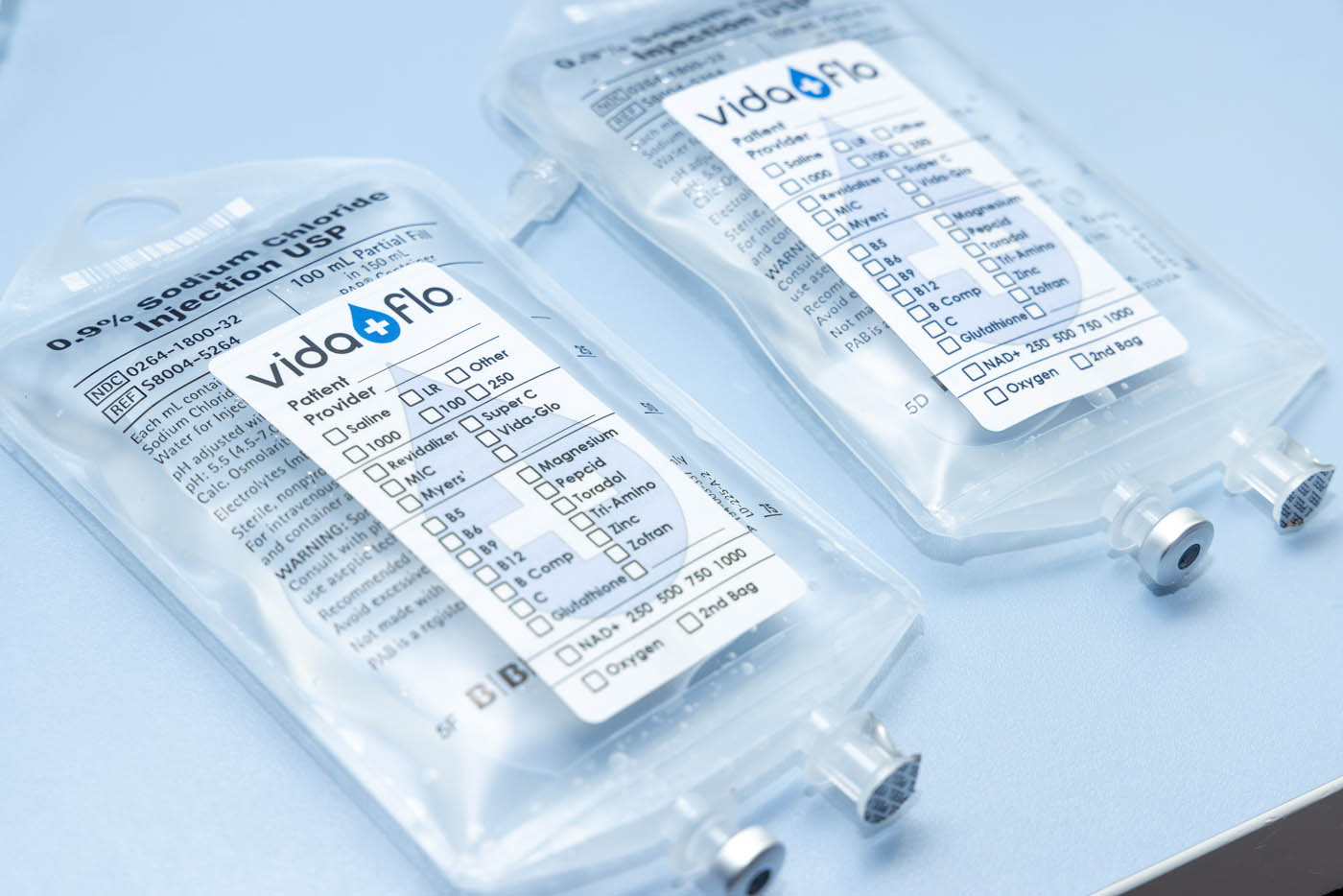 Two sealed IV bags with vitamins on ice for infusions at Vida-Flo Decatur Atlanta.