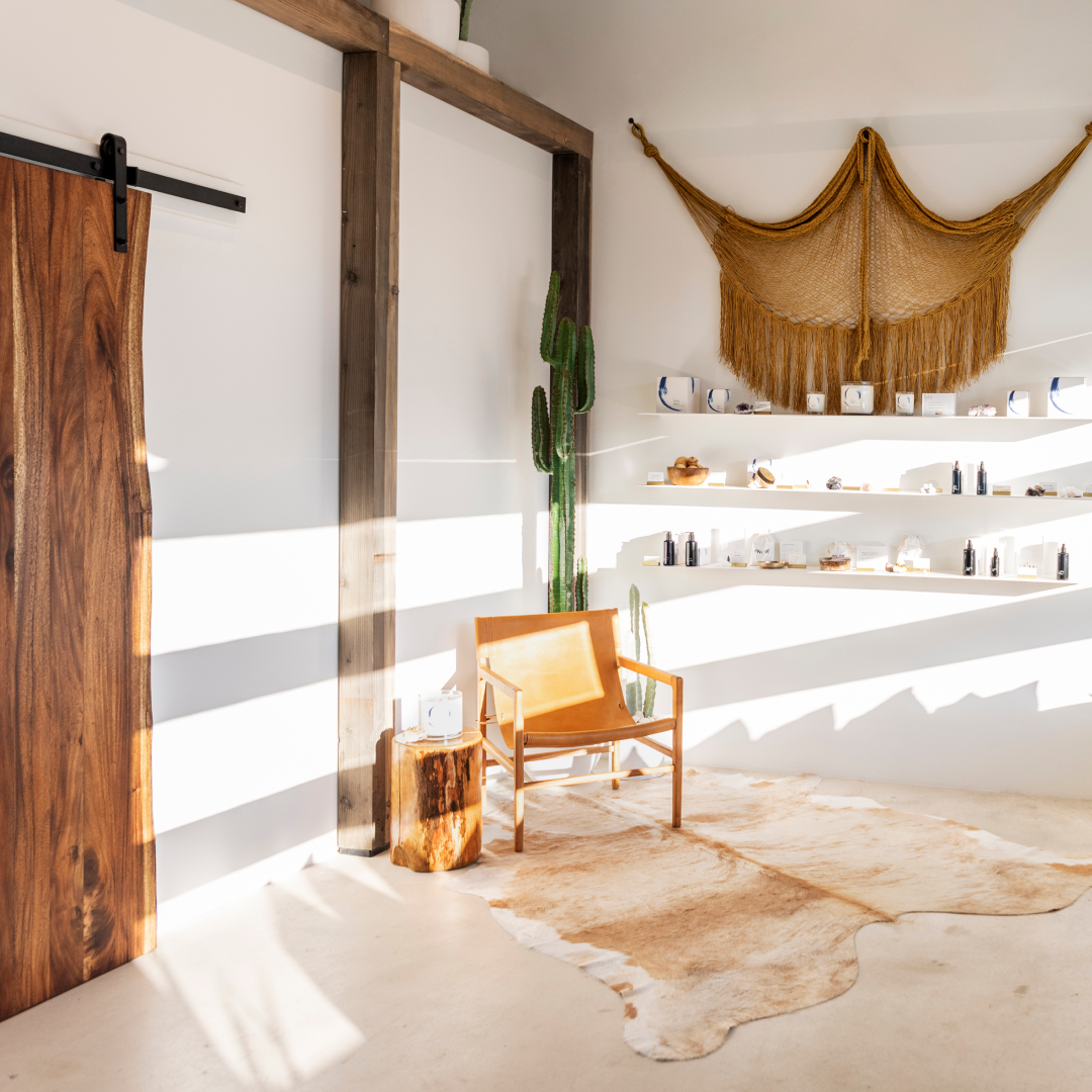 Bright retail corner displaying wellness products inside The NOW Massage Mount Pleasant.