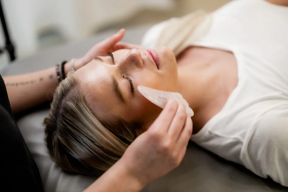 Esthetician performing a facial at FACE FOUNDRIE Austin SoCo