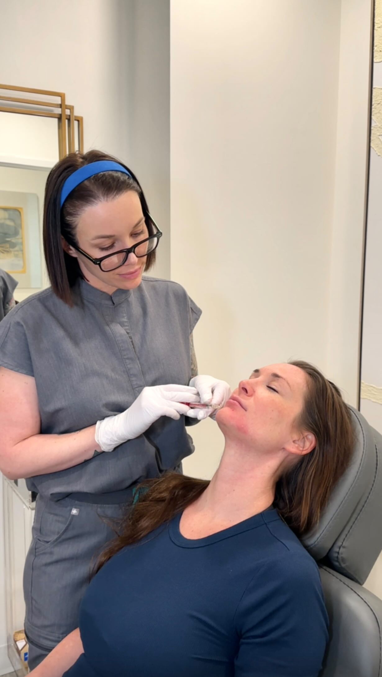 Practitioner performing skin-tightening facial treatment
