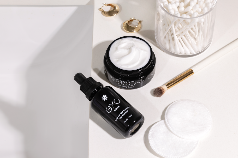 Exoceuticals serum and face cream flatlay with beauty tools