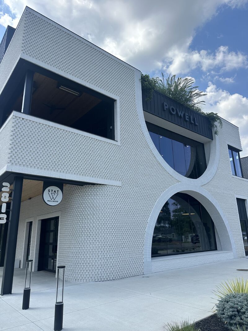Modern white STAT Wellness Nashville Berry Hill building with curved windows