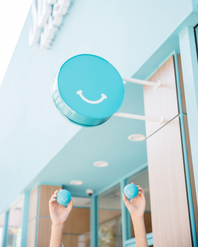 Light and bright lobby with smiley balloon at Squeeze Charlotte Park Road