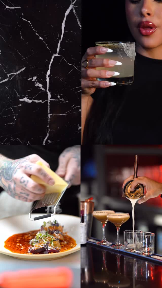 Bartender holding a drink beside small plates and kitchen prep at Beso Buckhead.