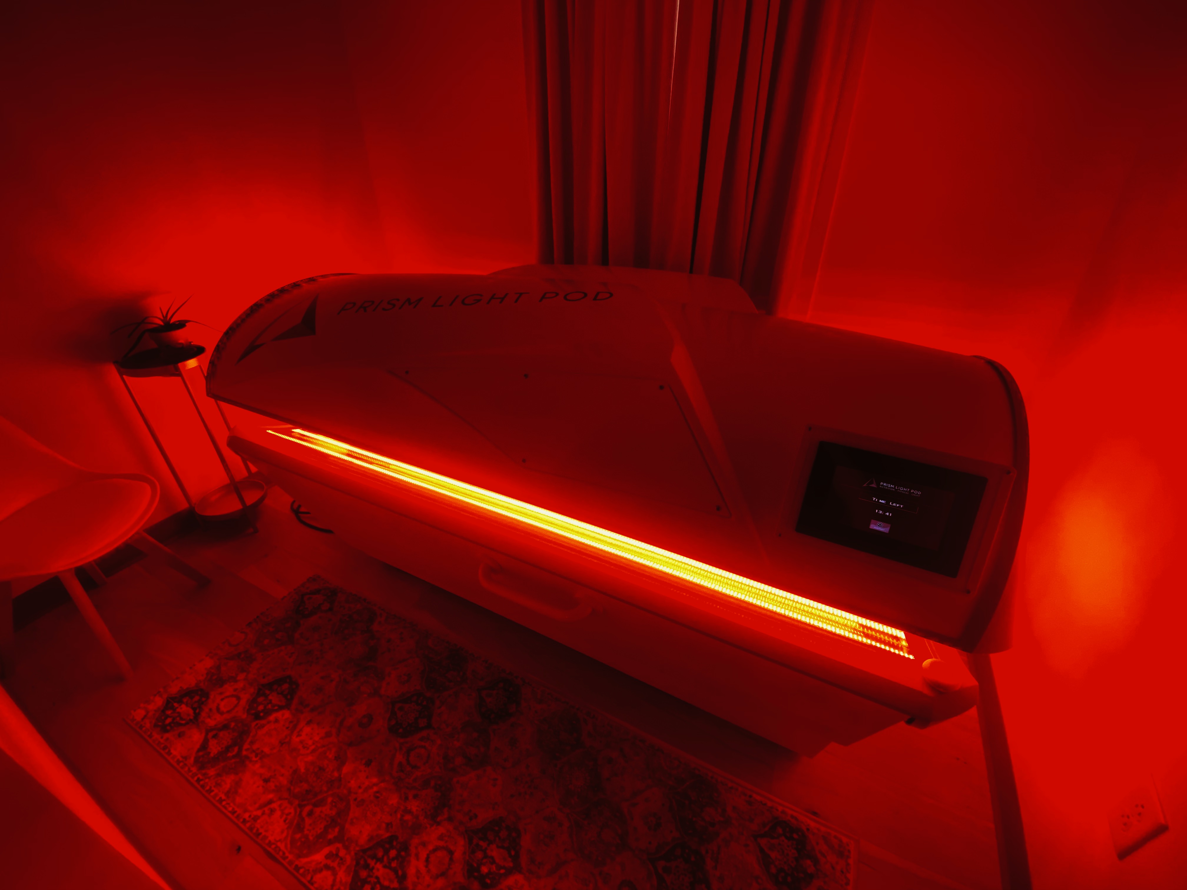 Side view of LED red-light therapy bench and panels at Modern Chiropractic Johns Island Charleston