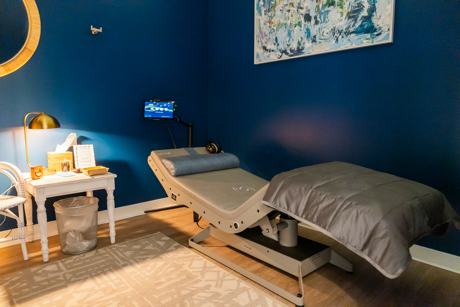 Lymphatic drainage therapy room with treatment bed at Rest + Fuel Buckhead