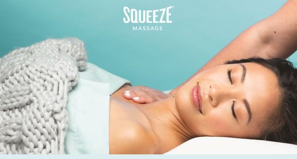 Guest relaxing during a custom massage at Squeeze Charlotte Park Road