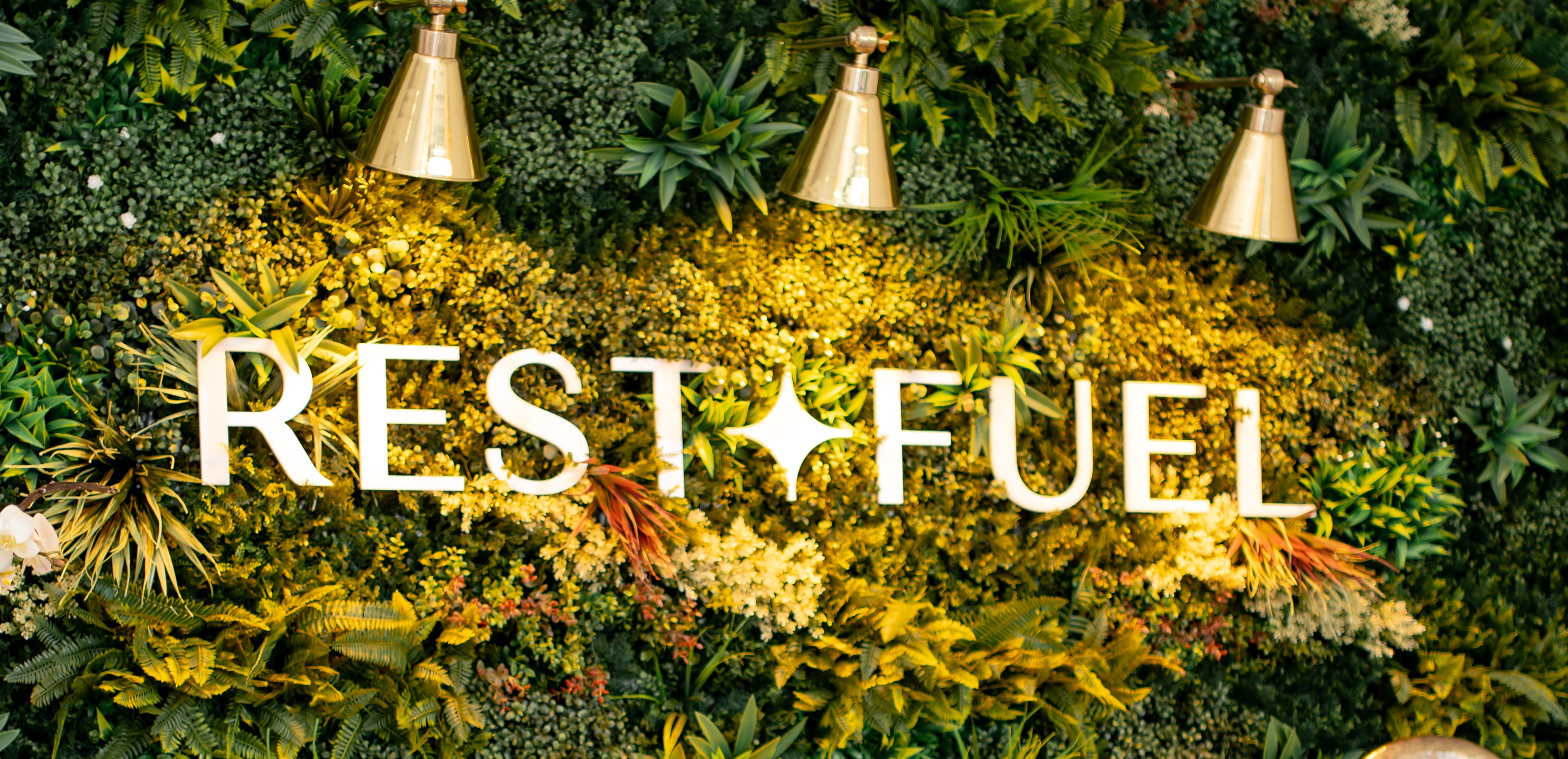 Rest + Fuel living-wall logo sign at the Buckhead Atlanta wellness studio