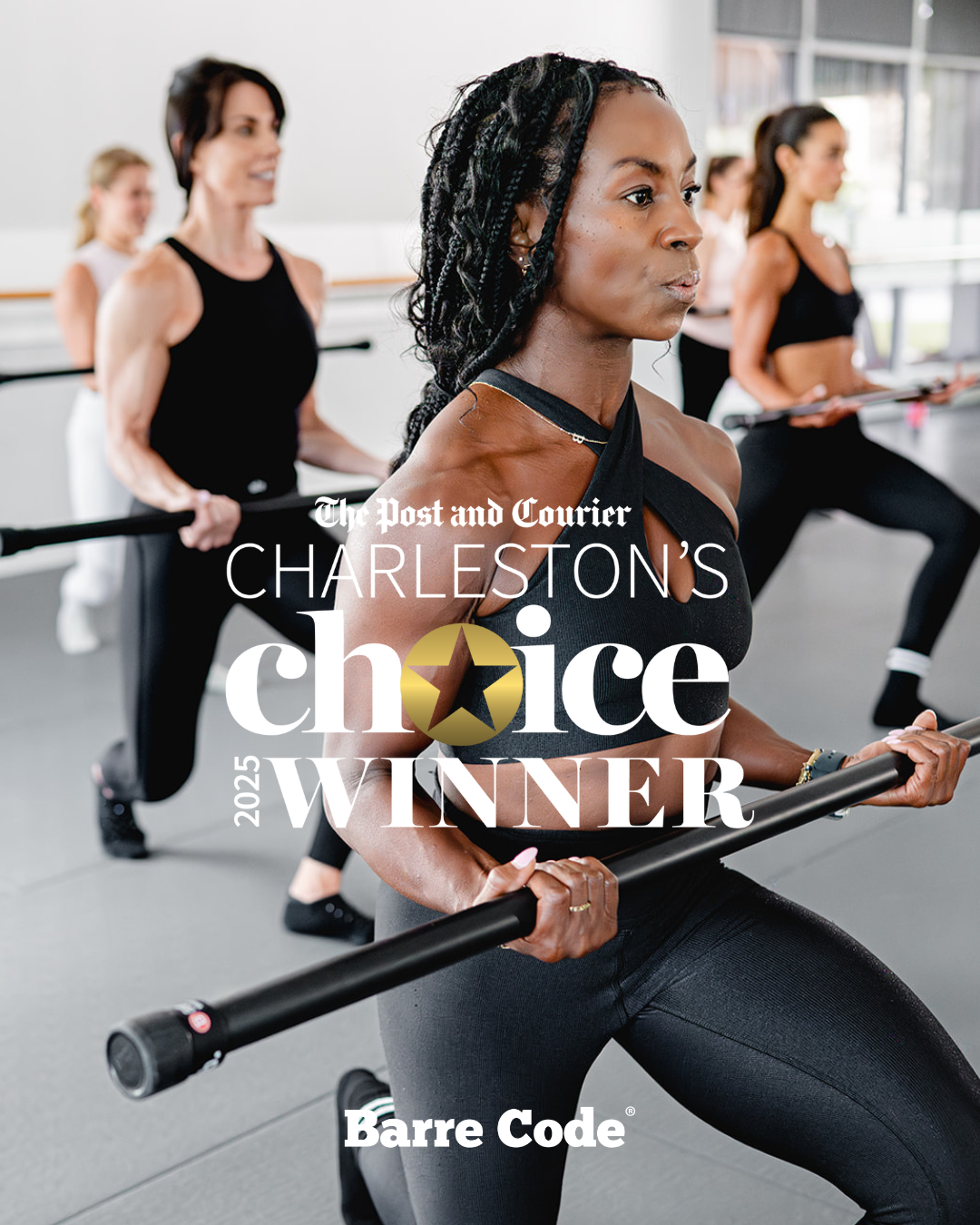 Instructor with mic guiding clients using light dumbbells during a barre workout