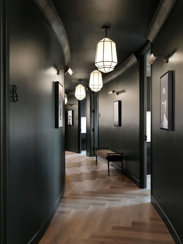 Modern hallway with pendant lights at CULT Aesthetics Atlanta med spa interior.