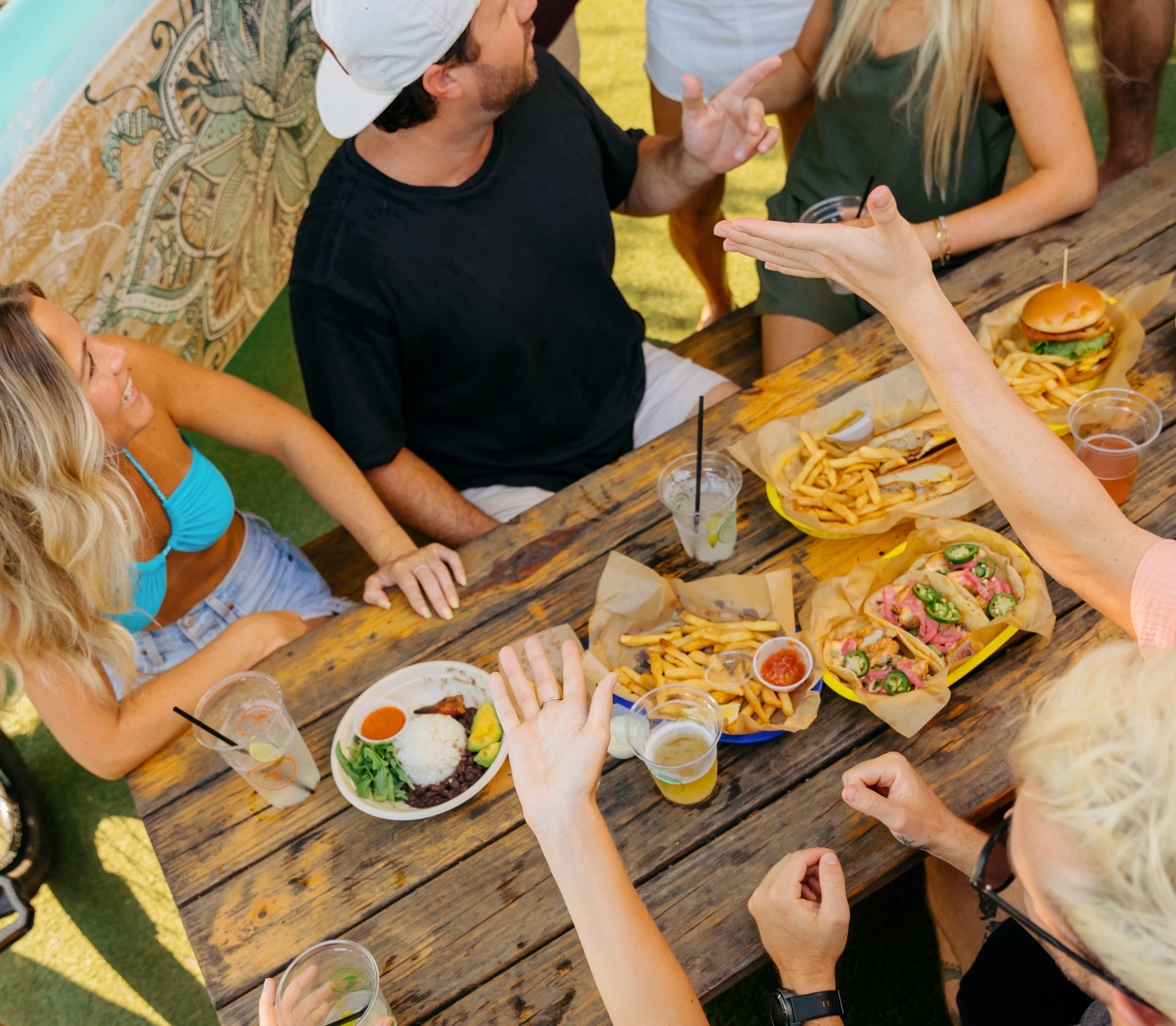 Friends sharing plates and cocktails at Chiringa Old Fourth Ward in Atlanta