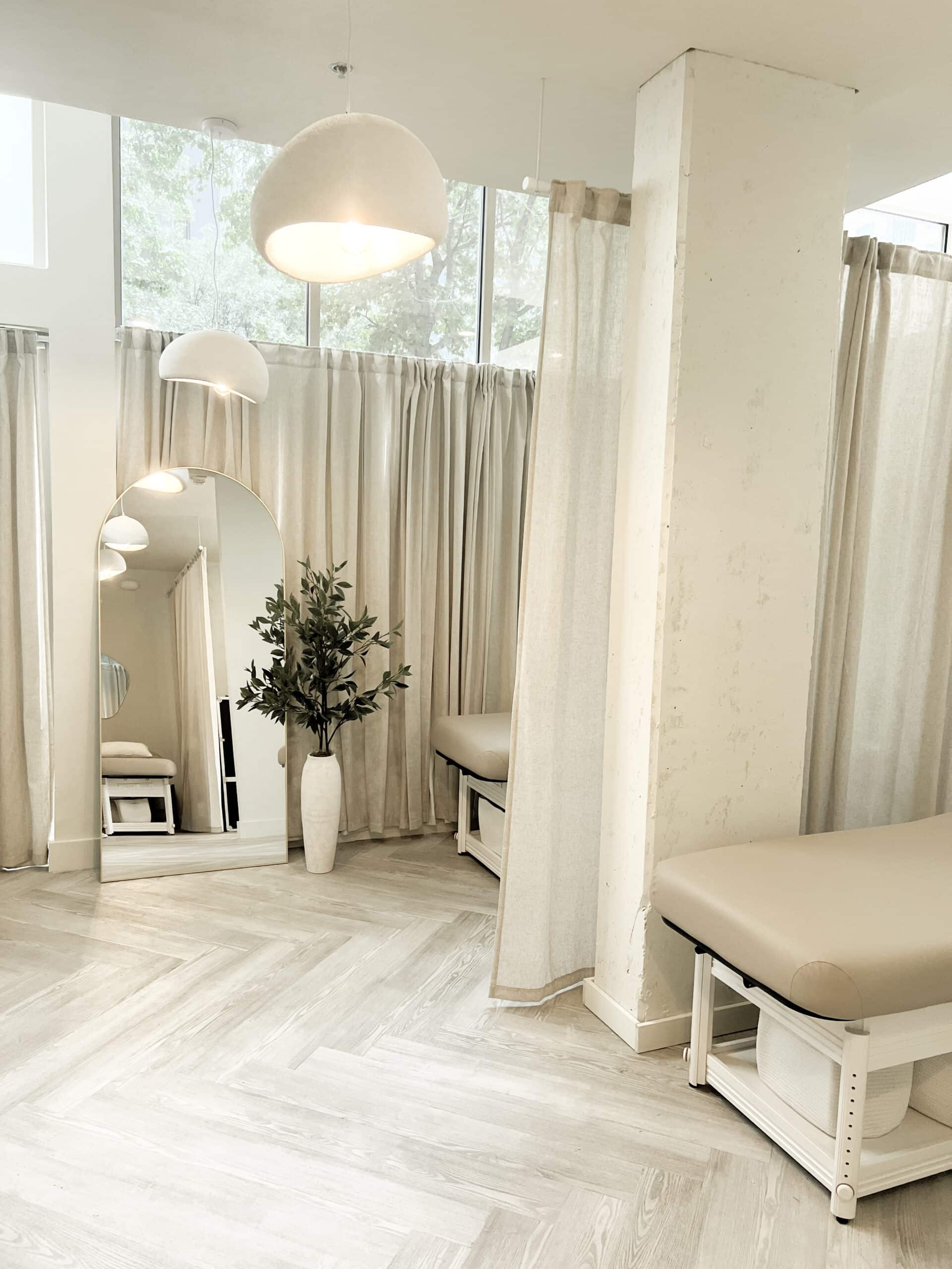 FACE FOUNDRIE Austin SoCo treatment lounge with draped curtains and neutral seating