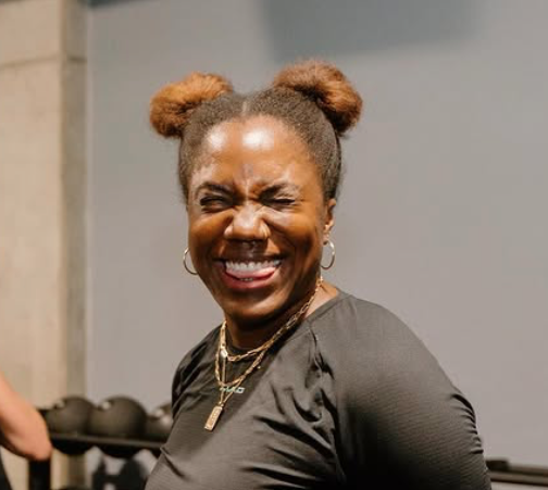 Headshot of owner Rae Dillard smiling after workout at MADabolic Atlanta functional-training gym.