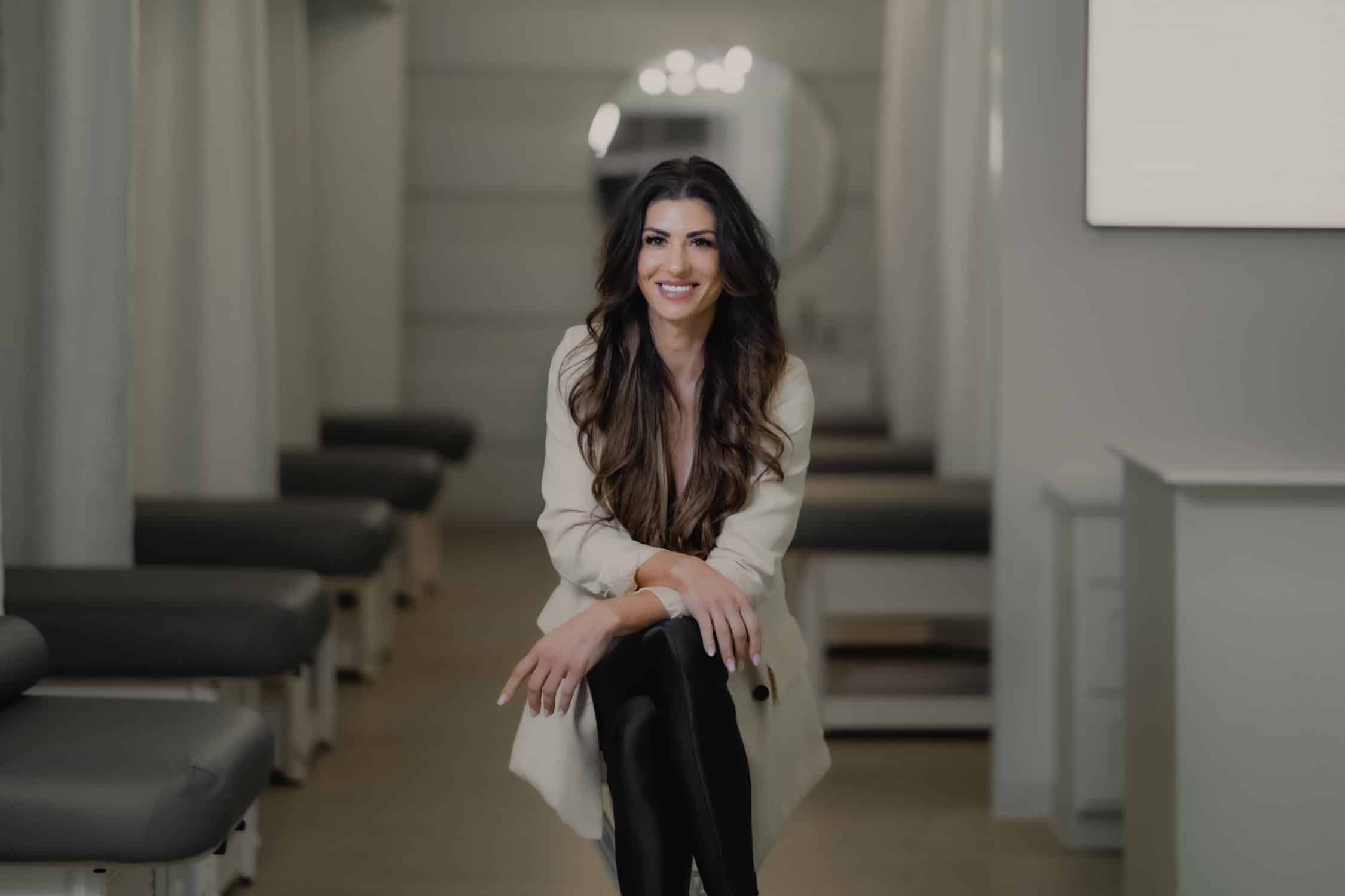 Smiling FACE FOUNDRIE leader seated inside the Austin SoCo studio