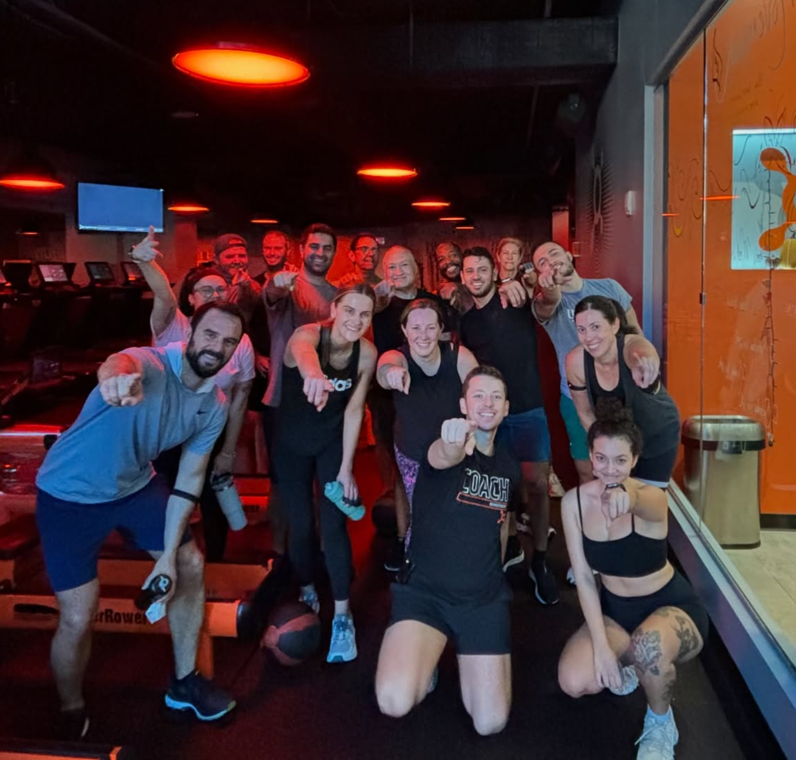 Coaches and staff group photo at Orangetheory Charleston – West Ashley lobby.
